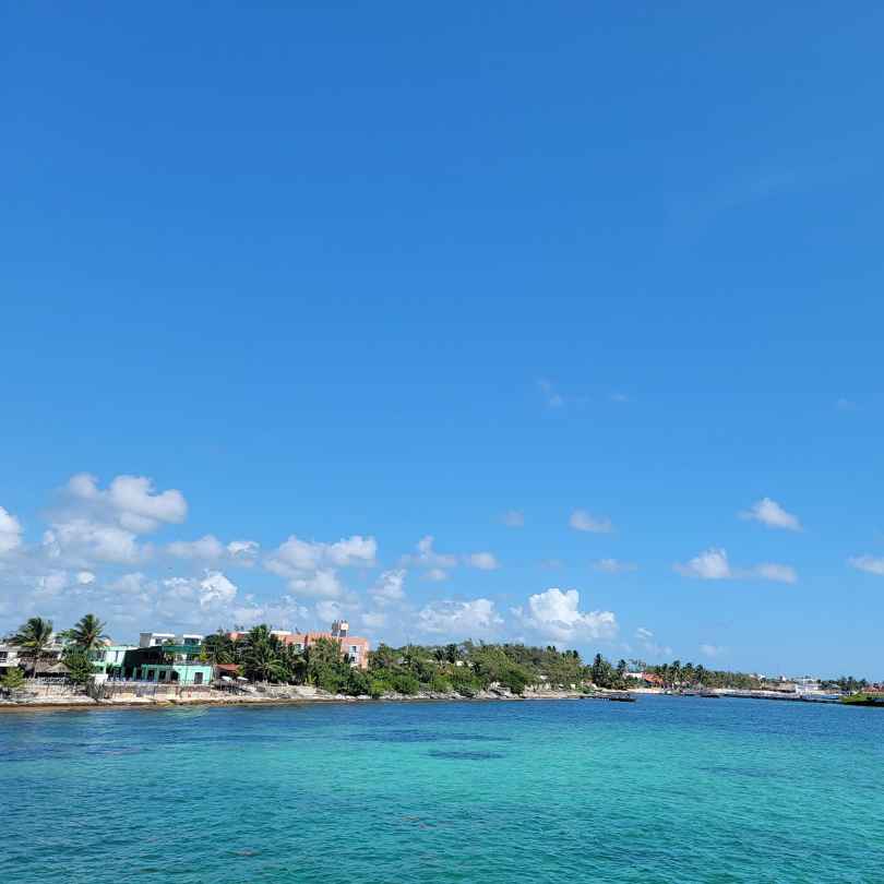 view of isla mujeres from ocean during the day