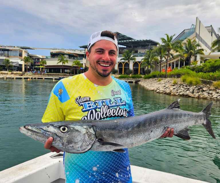man holding fish caught after reading deep sea fishing in cancun first time guide