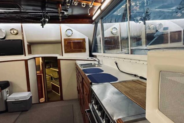 inside 6 Hr Deep Sea Fishing Charter boat showing kitchen and seating area