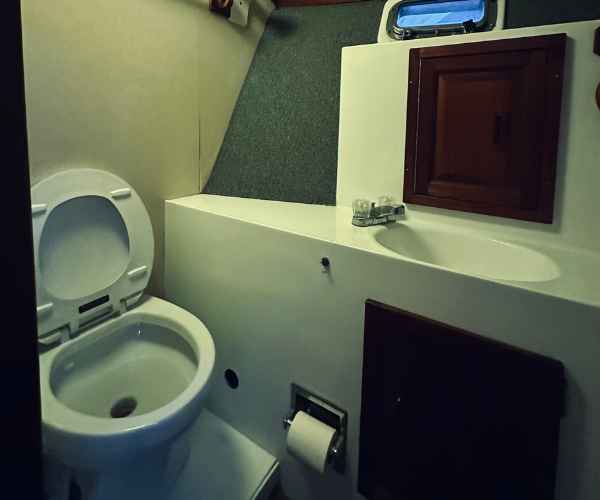 inside cancun charter fishing boat showing full bathroom